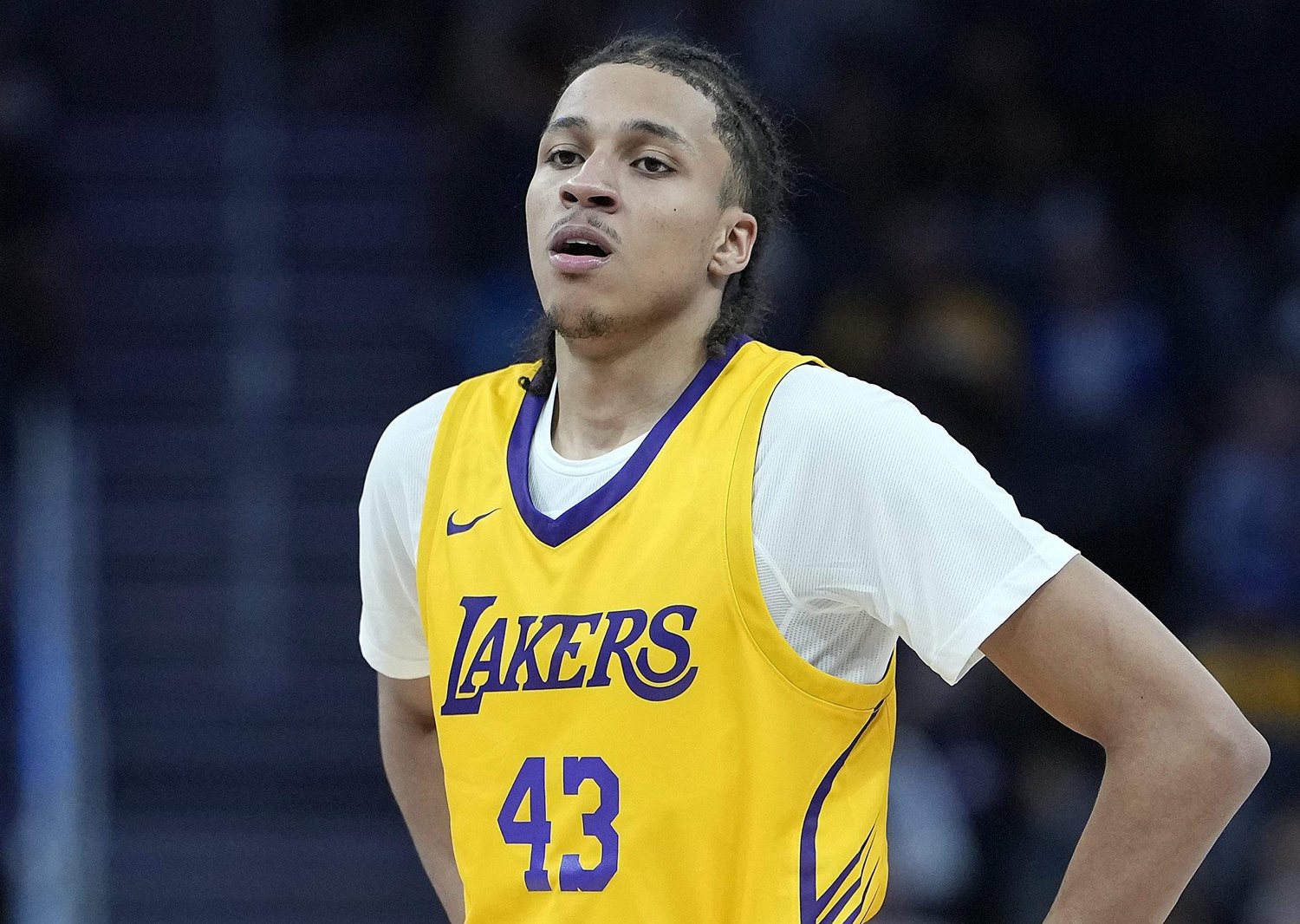 Cameron Carr wears a gold Lakers No. 43 jersey over a white shirt on the court.