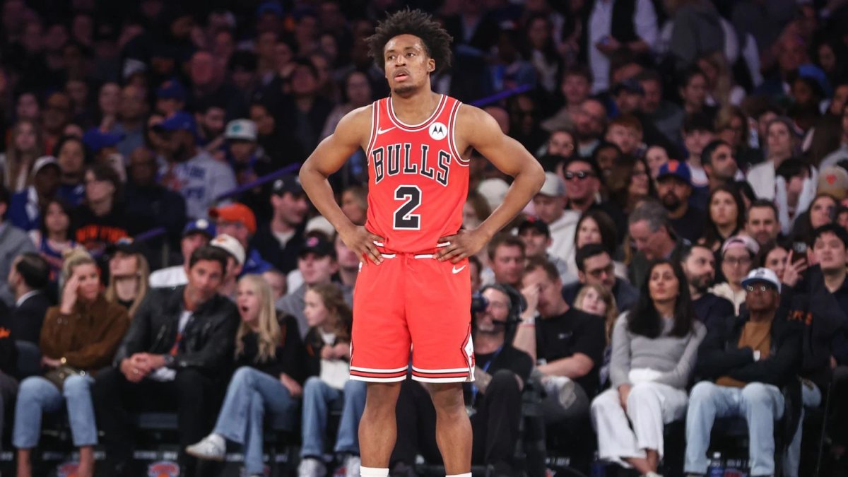Collin Sexton stands with his hands on his hips in a red Chicago Bulls No. 2 jersey.