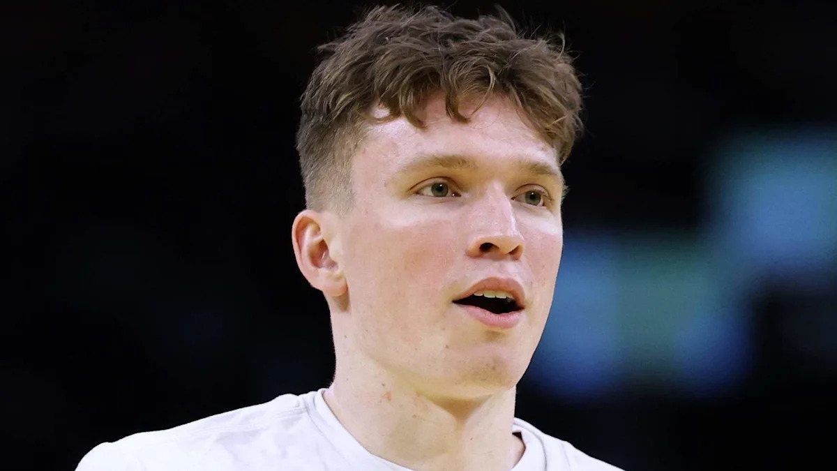Close-up of Dalton Knecht in a white shirt.